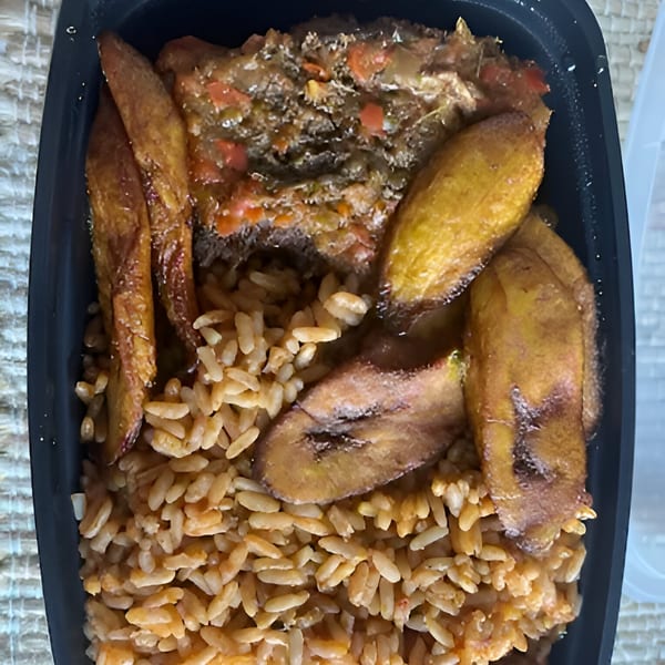 African cuisine meal with jollof rice, fried plantains, and a rich stew in a black container.